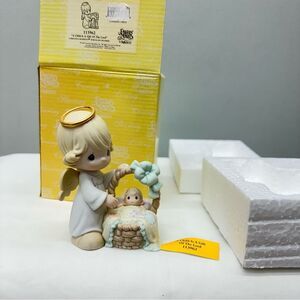 NIB Precious Moments a child‎ is a gift of the Lord porcelain figurine.